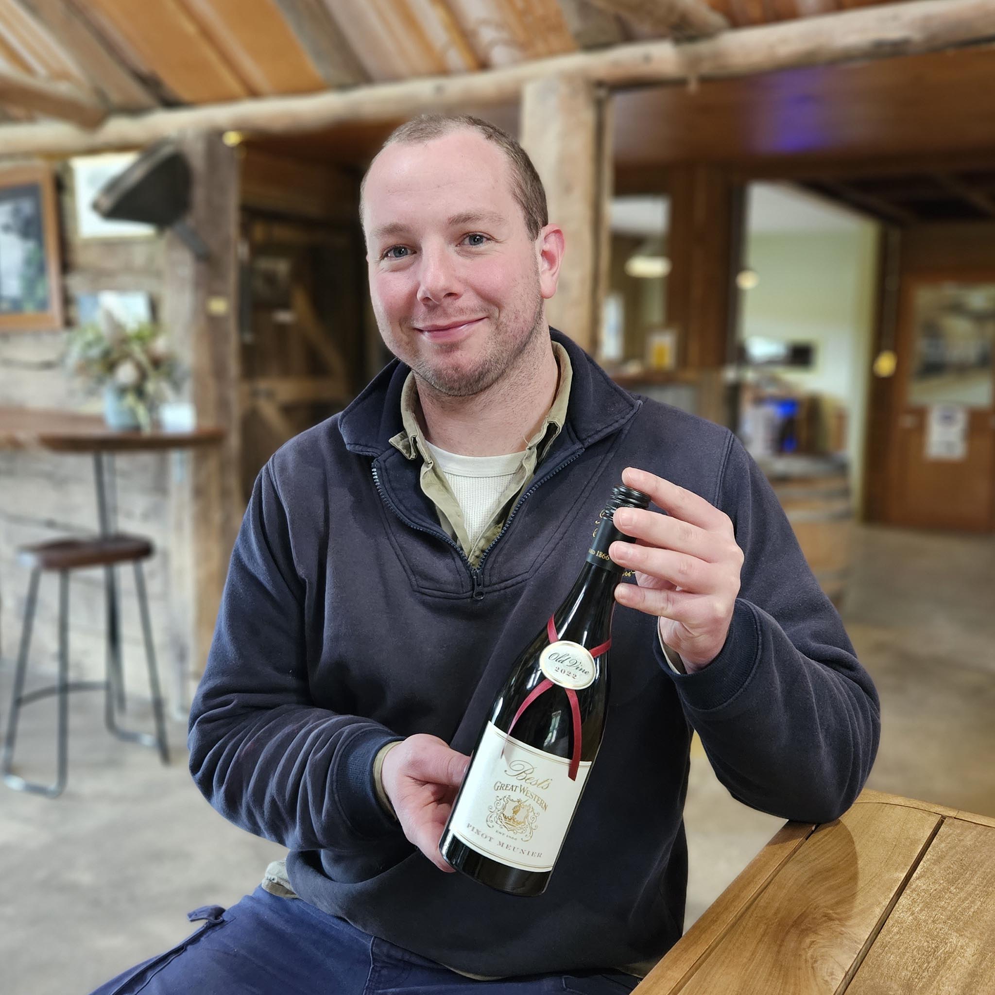 Winemaker Jacob Parton with a bottle of Best's Great Western Old Vine Pinot Meunier