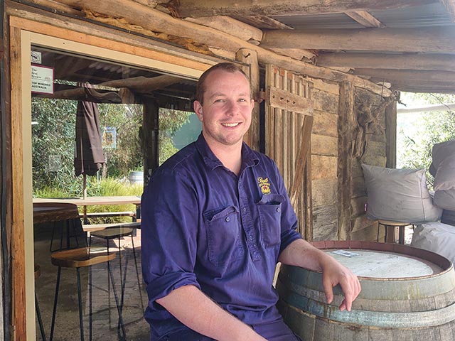 Jacob Parton sitting in front of Bests Cellar Door