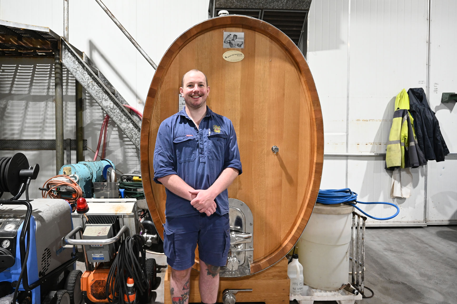 Winemaker Jacob Parton standing in front of a 2,500 litre oak foudre